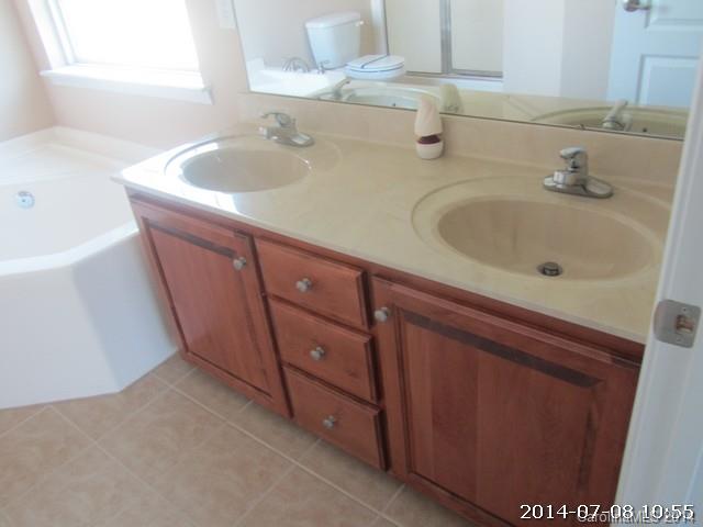 2904 Ruben Road, Unit 3 Monroe, NC 28112 - Photo 9 of 9 a bathroom with a sink and a mirror