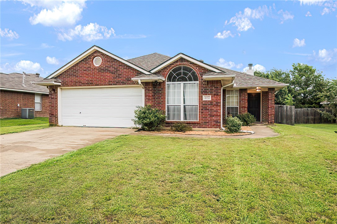 a front view of a house with yard