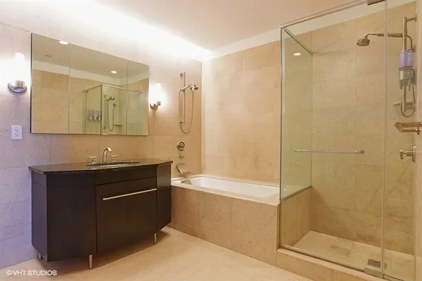 a bathroom with a bathtub and a shower