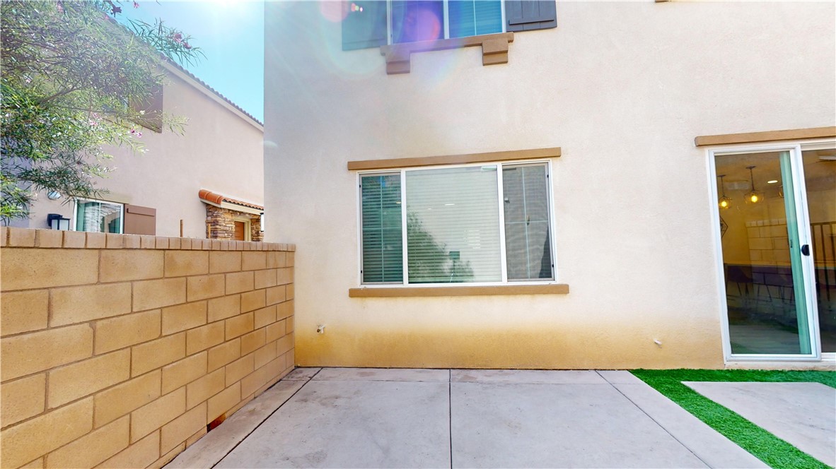165 Linden Court Perris, CA 92571 - Photo 25 of 36 a view of a brick house with a window