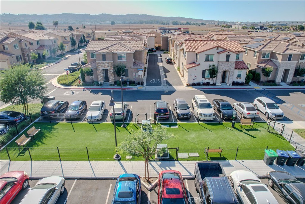 165 Linden Court Perris, CA 92571 - Photo 31 of 36 an aerial view of a house with a garden and houses