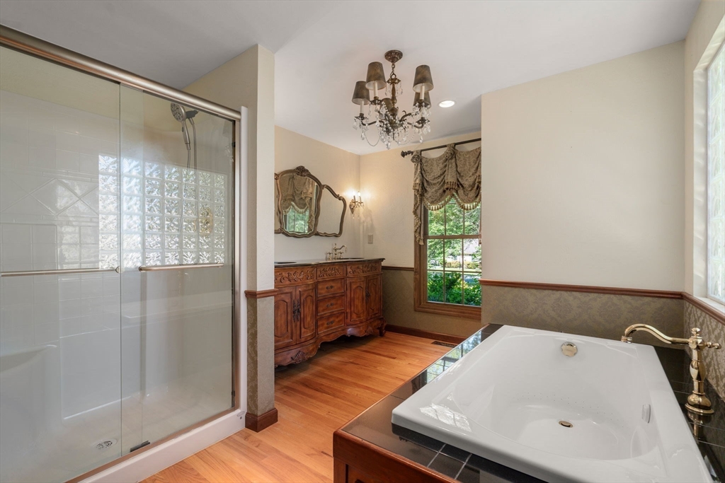 2035 Parker Street Springfield, MA 01128 - Photo 26 of 42 a bathroom with a tub sink and mirror