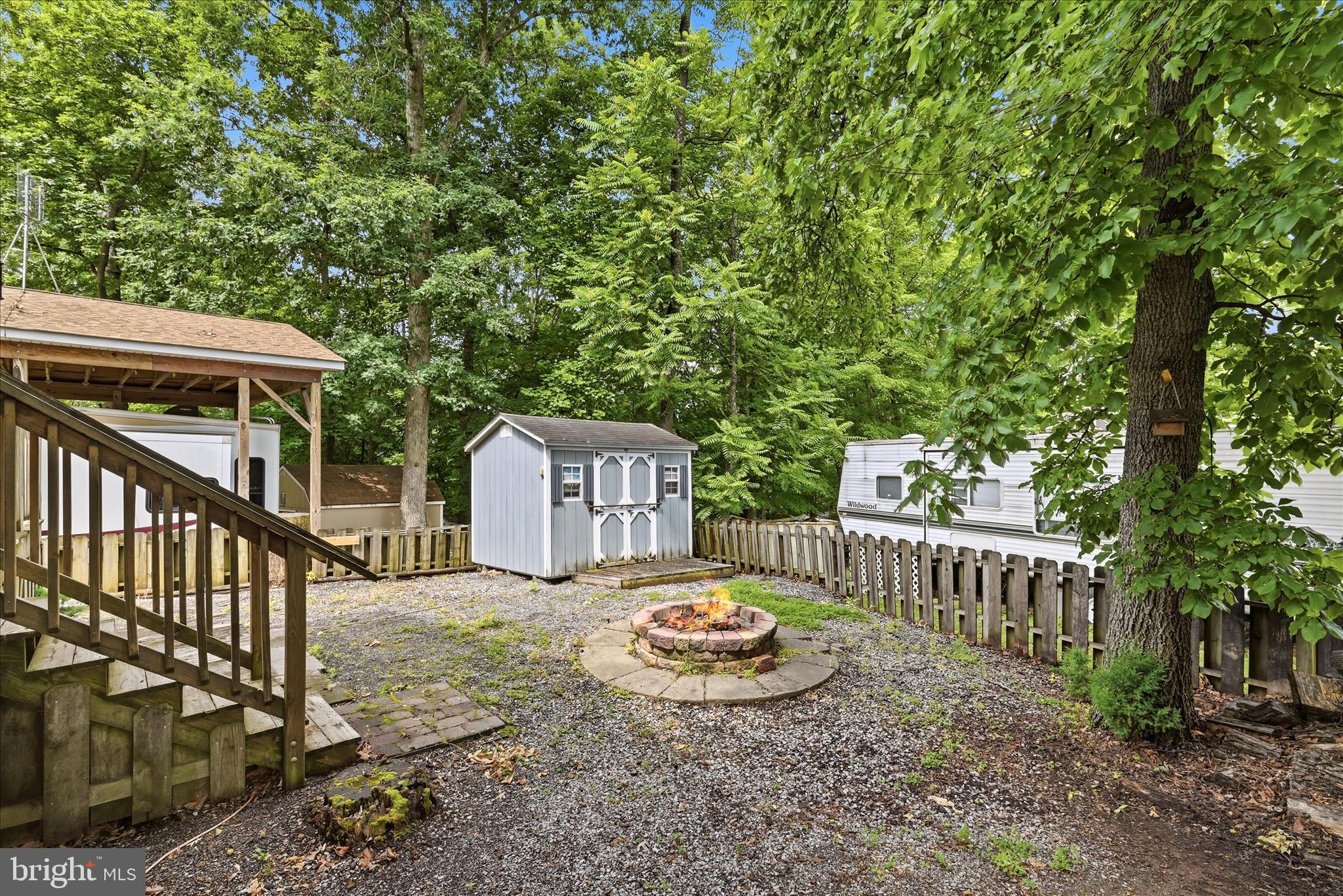 Lot 20 Hot Dog Road Falling Waters, WV 25419 - Photo 16 of 26 a view of a house with backyard and sitting area