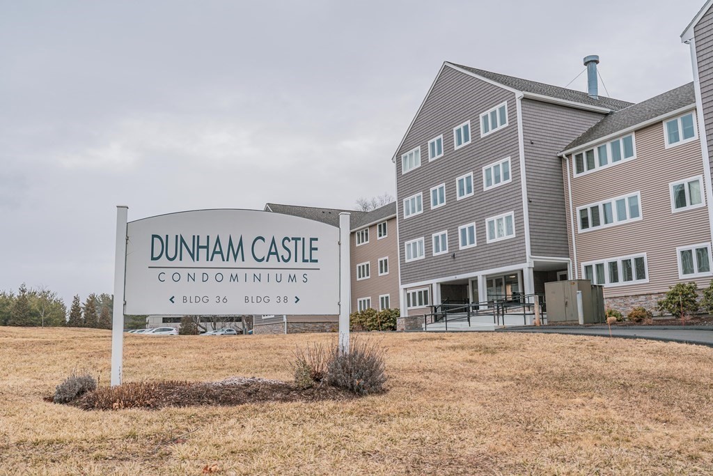 a view of a brick building with many windows