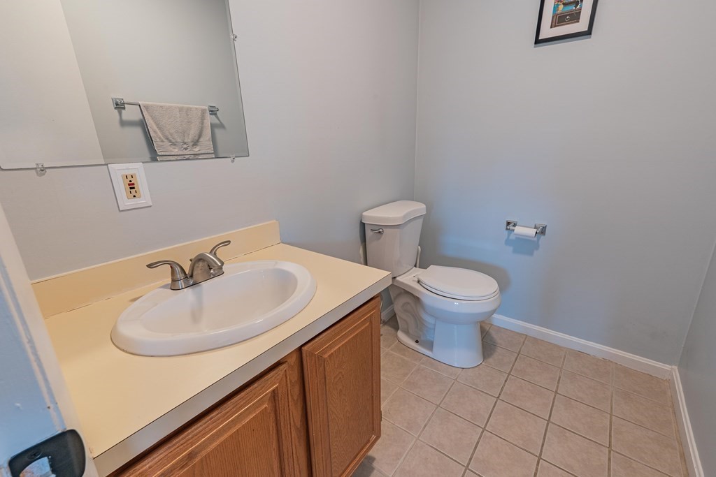 38 Dunham Road, Unit 210 Beverly, MA 01915 - Photo 19 of 30 a bathroom with a sink and a toilet