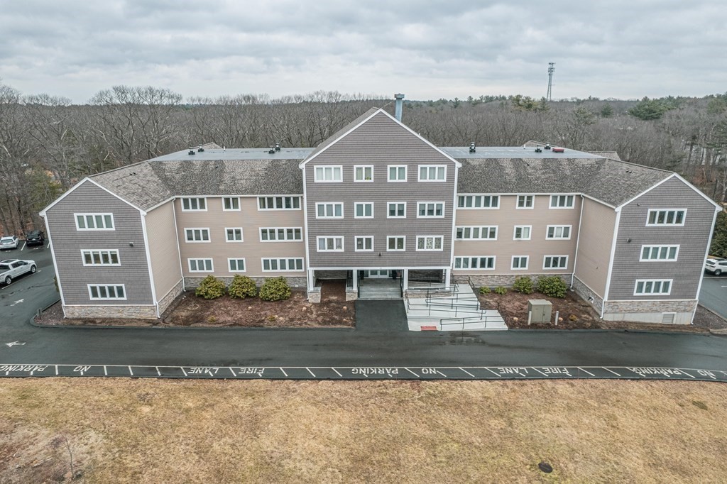 38 Dunham Road, Unit 210 Beverly, MA 01915 - Photo 2 of 30 a front view of a house