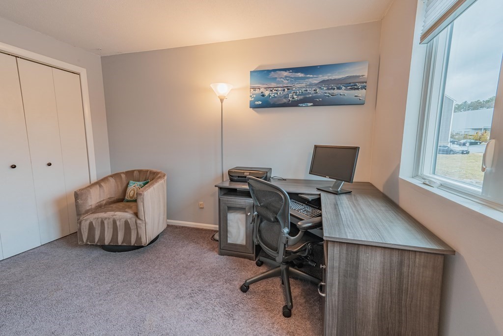 38 Dunham Road, Unit 210 Beverly, MA 01915 - Photo 21 of 30 a view of workspace with furniture and a window