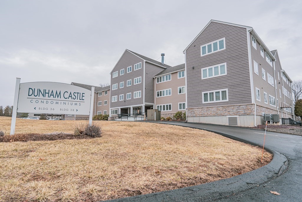 38 Dunham Road, Unit 210 Beverly, MA 01915 - Photo 22 of 30 a view of large building with a street