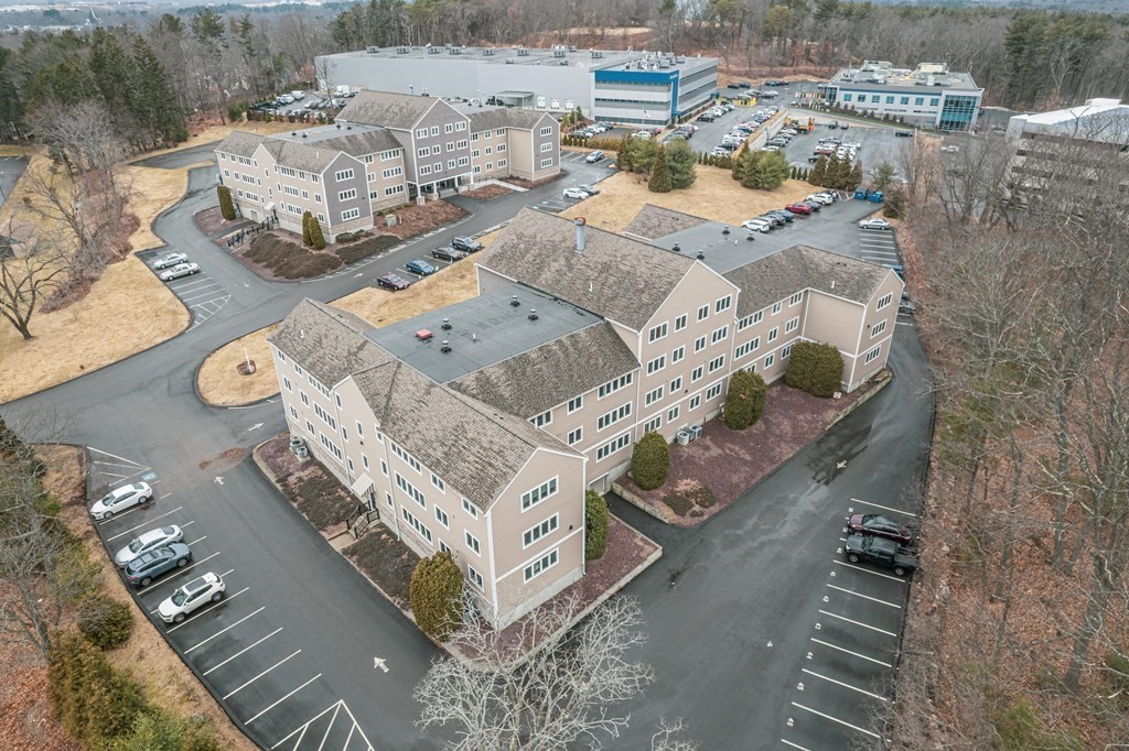 38 Dunham Road, Unit 210 Beverly, MA 01915 - Photo 25 of 30 an aerial view of a house with outdoor space