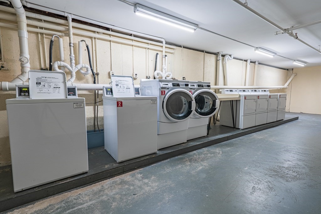 38 Dunham Road, Unit 210 Beverly, MA 01915 - Photo 27 of 30 a utility room with dryer and washer