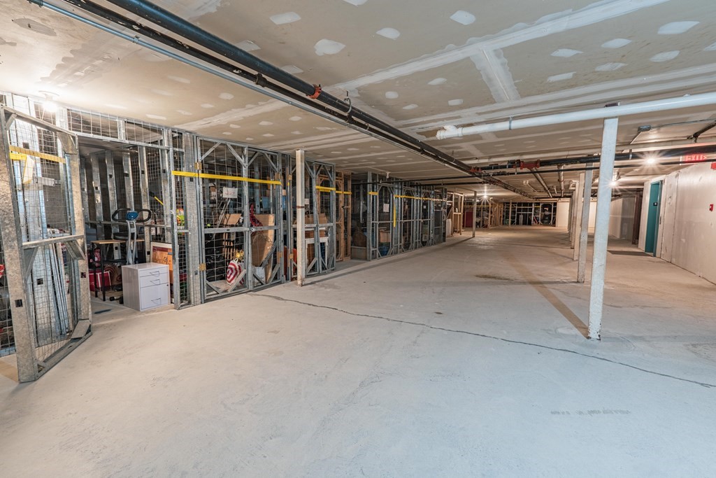 38 Dunham Road, Unit 210 Beverly, MA 01915 - Photo 30 of 30 a view of an empty room with wooden floor