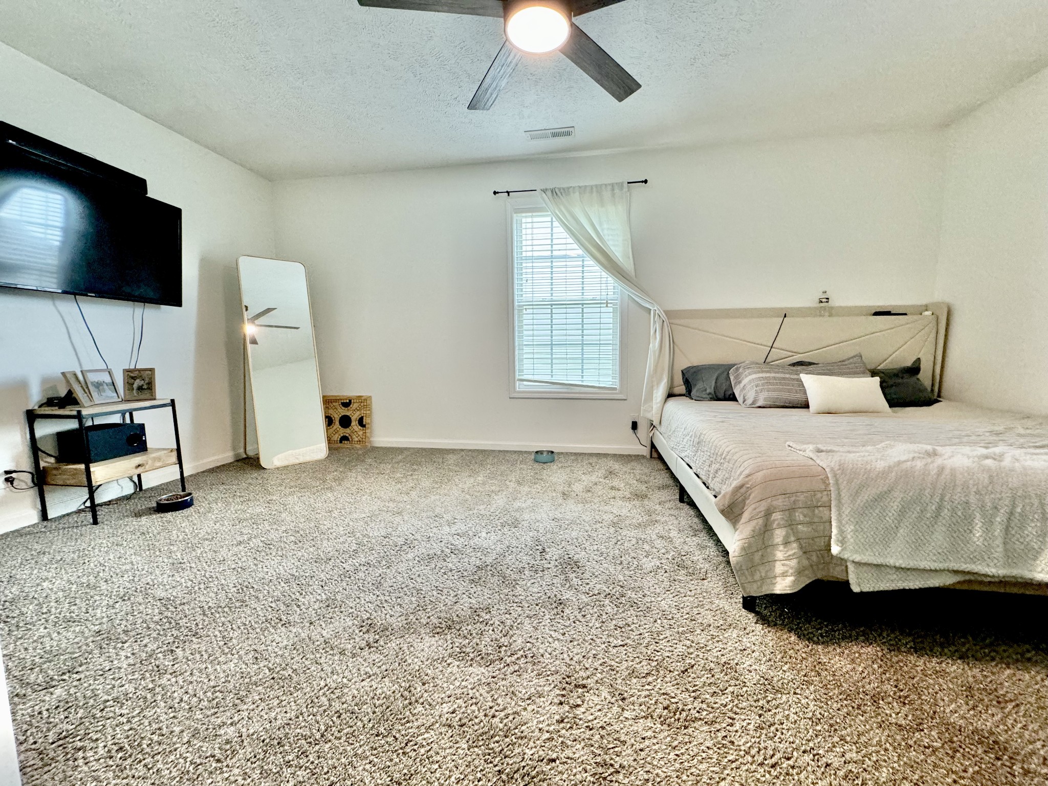 3769 Suiter Road Clarksville, TN 37040 - Photo 8 of 10 a bedroom with a bed and a flat screen tv