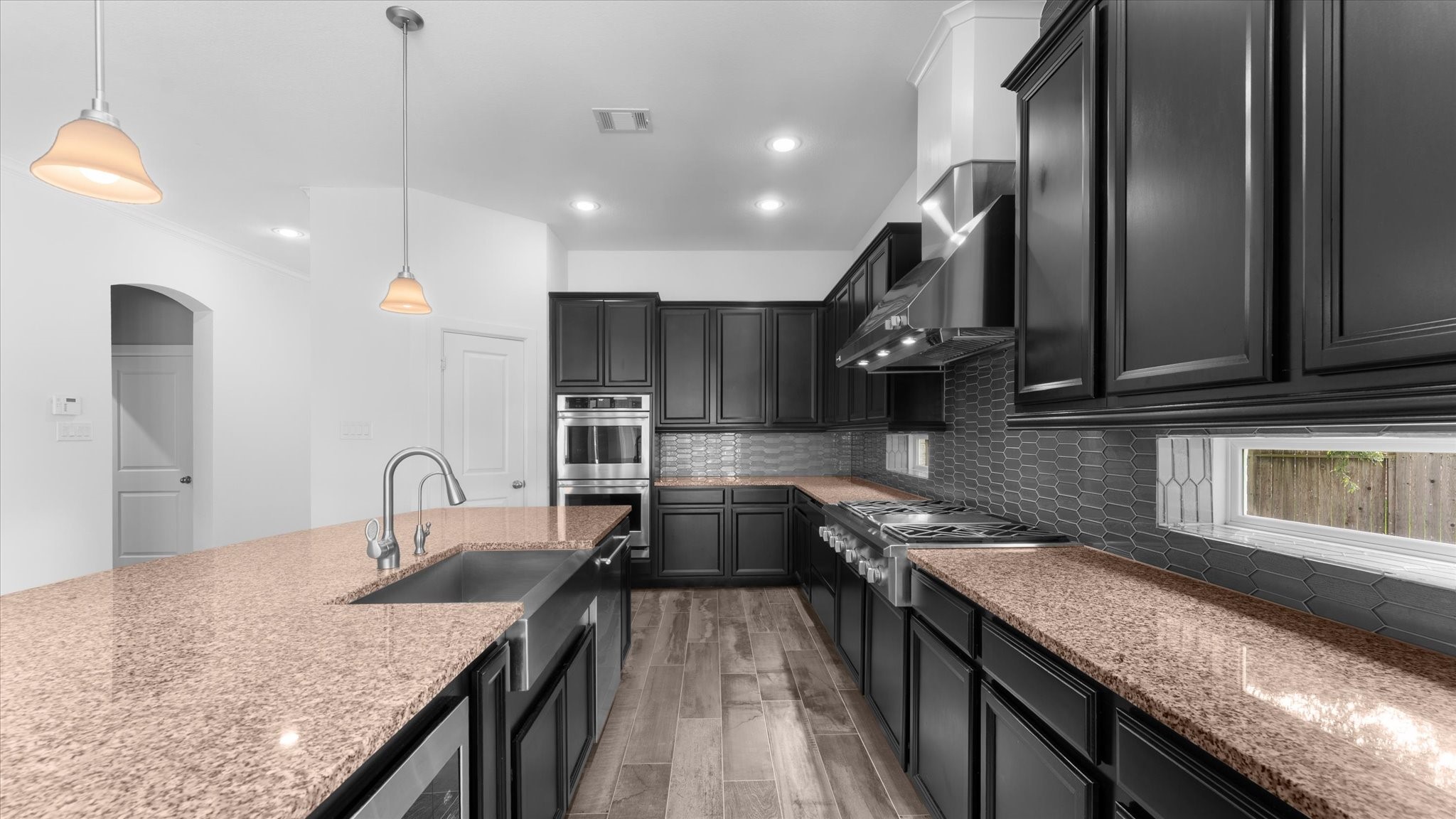32001 Birch Briar Court Spring, TX 77386 - Photo 11 of 48 Chef-inspired kitchen featuring granite countertops, custom cabinetry, stainless steel appliances, and plenty of workspace for cooking and entertaining.