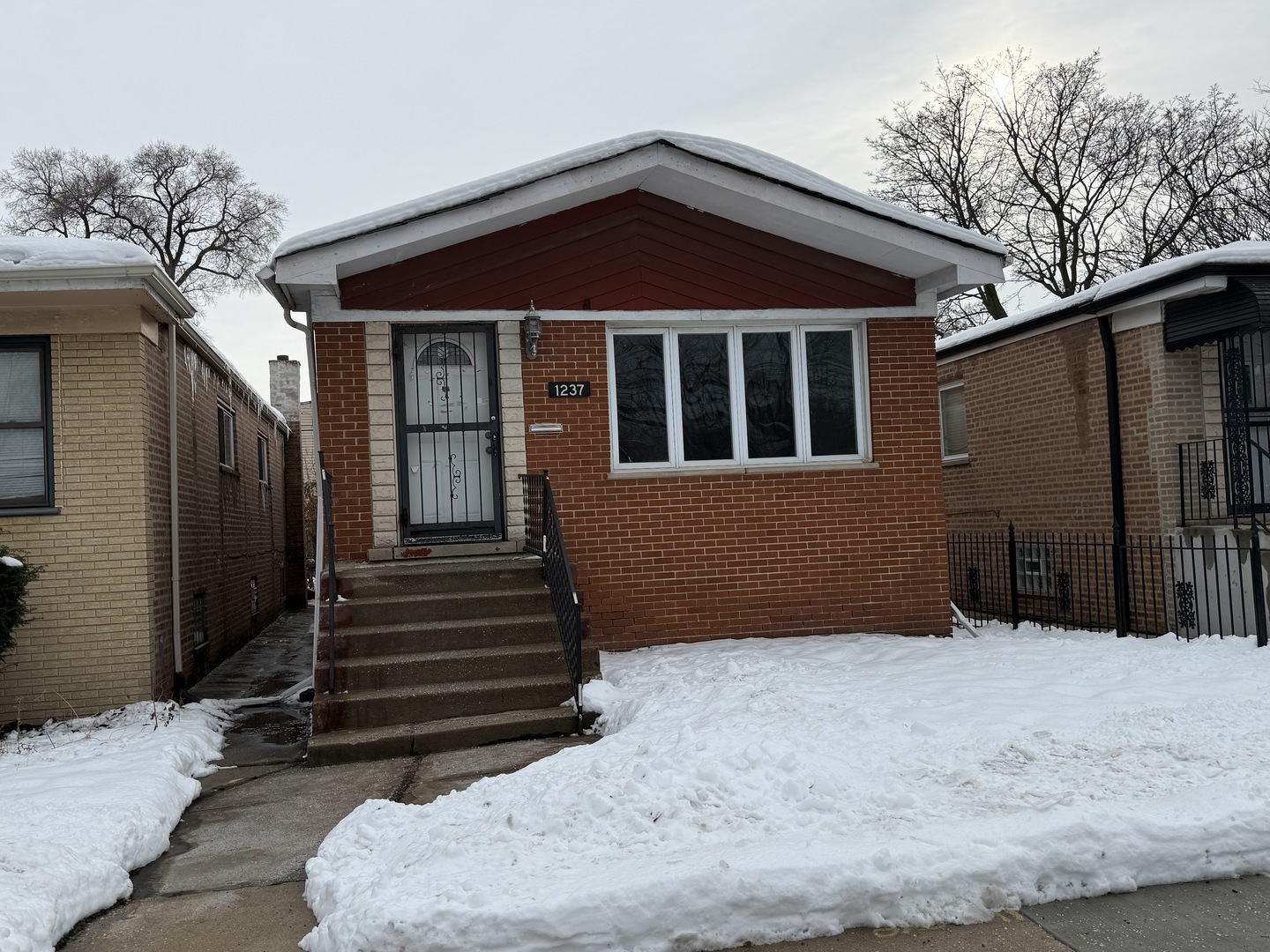 1237 East 95th Street Chicago, IL 60628 - Photo 1 of 11 a front view of a house with a yard