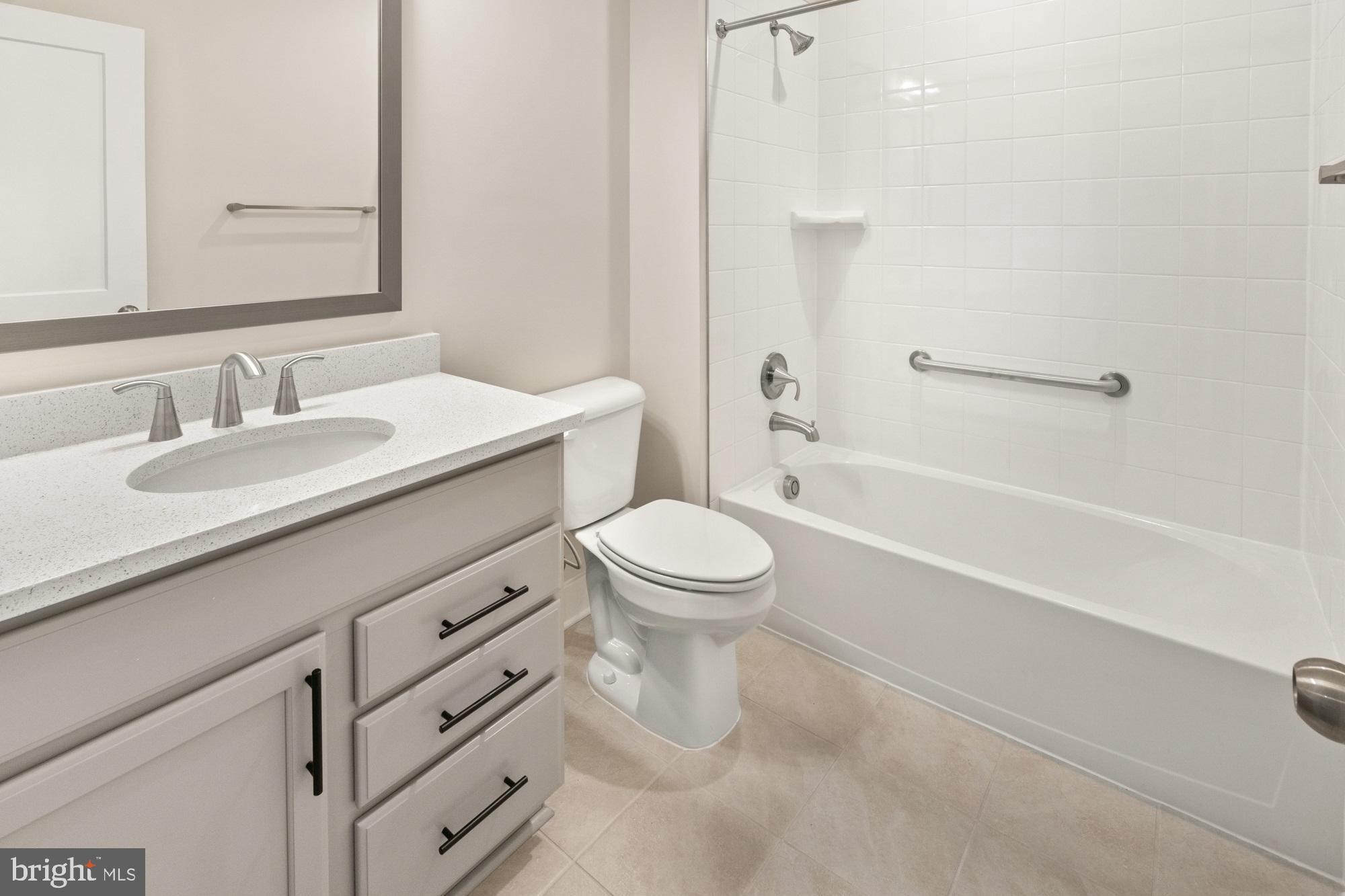 11310 Ingels Court Issue, MD 20645 - Photo 9 of 11 a bathroom with a sink a toilet and a bathtub