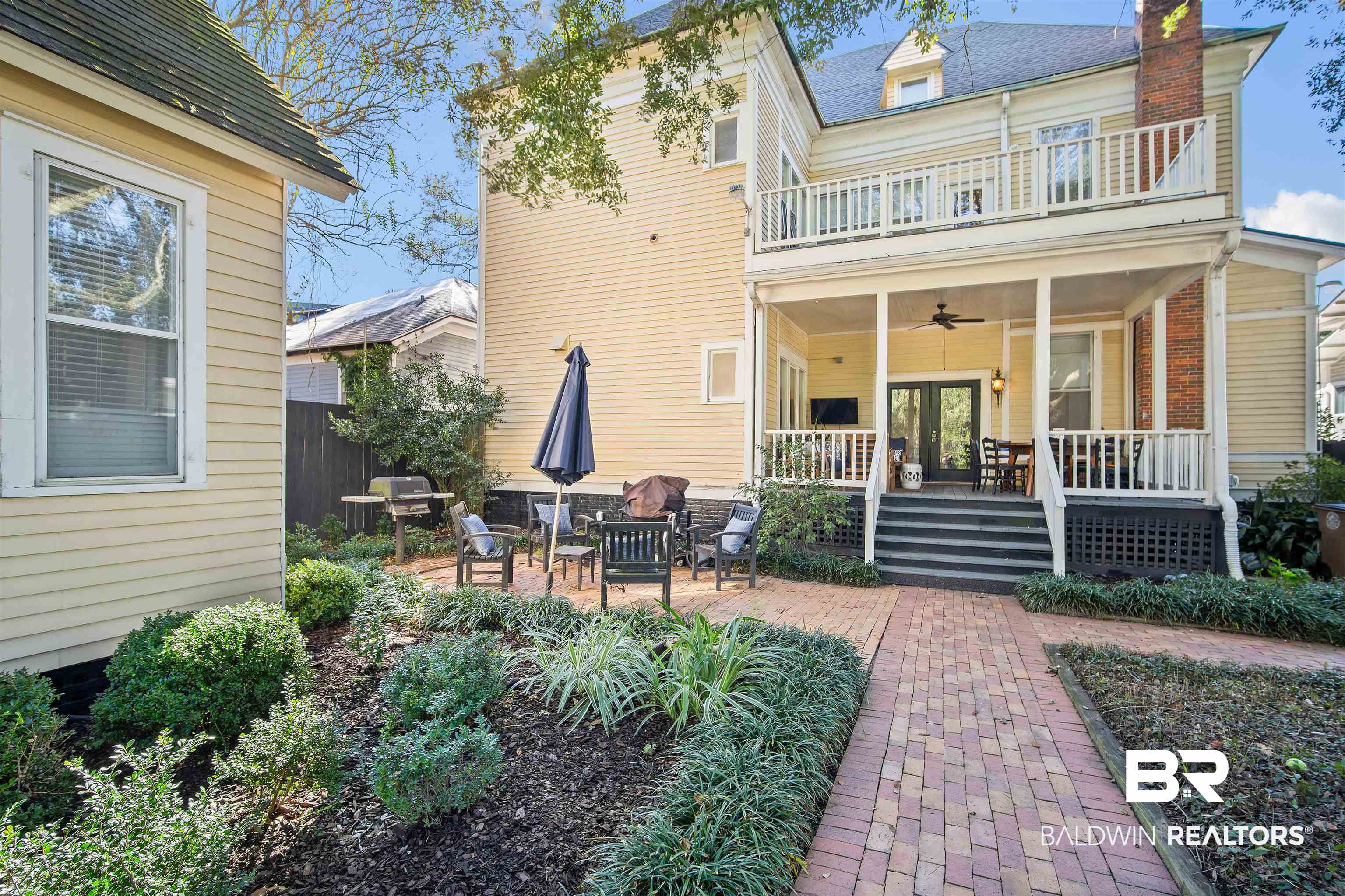 1314 Dauphin Street Mobile, AL 36604 - Photo 48 of 61 Rear view of property featuring a patio area, a balcony, and french doors