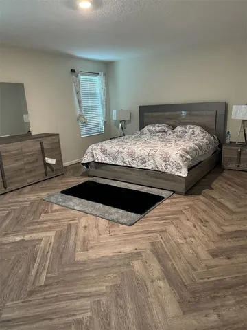 a kitchen with a sink a stove and cabinets