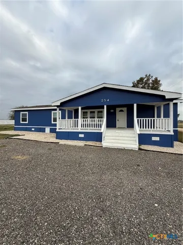a house view with a garden space