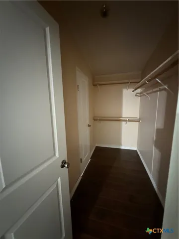 a view of an empty walk in closet