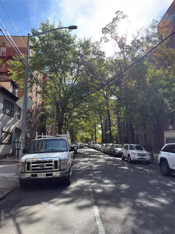 a view of a street with cars