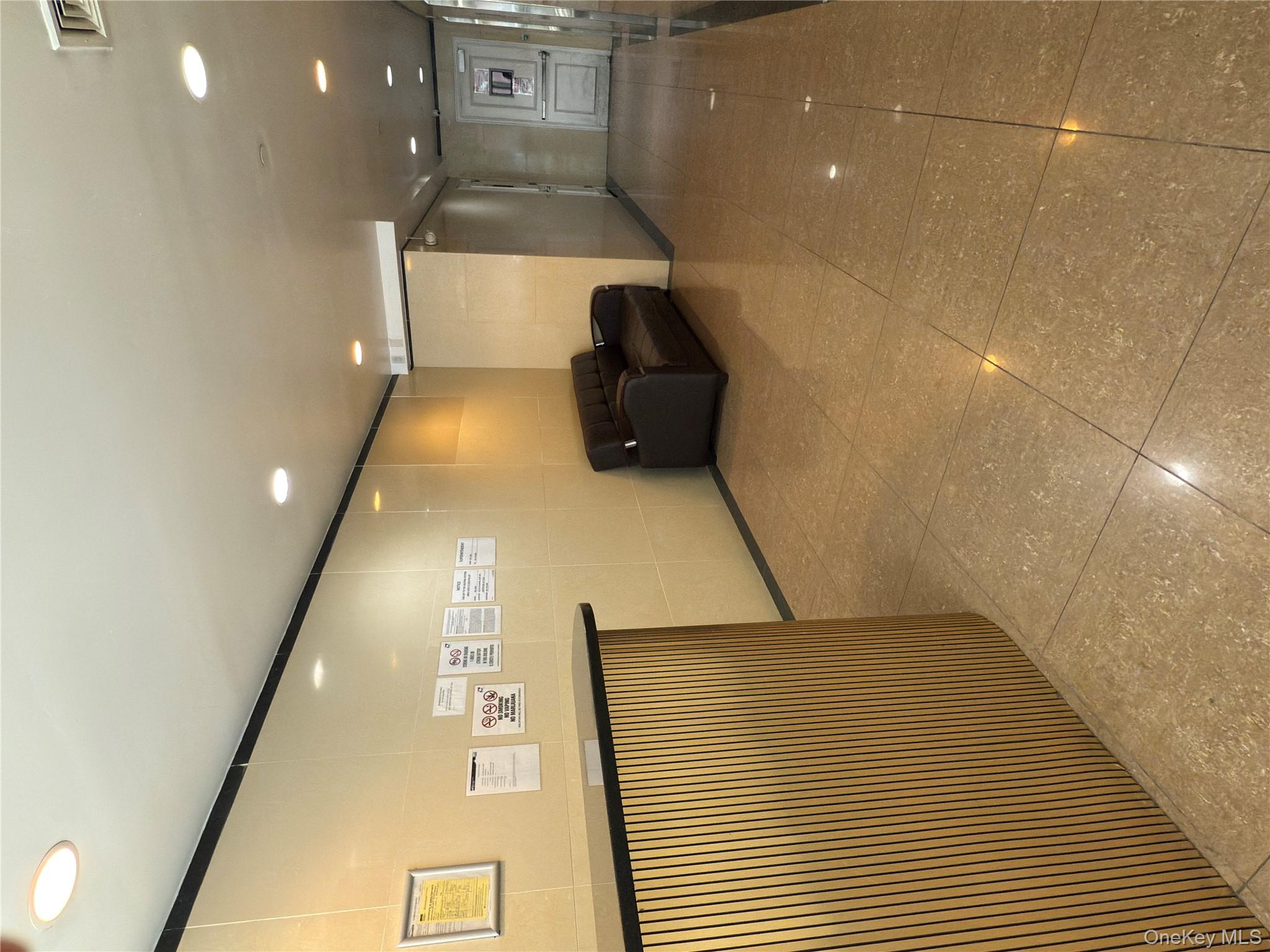 43-17 Union Street, Unit 8B Queens, NY 11355 - Photo 2 of 16 Corridor featuring recessed lighting and tile walls