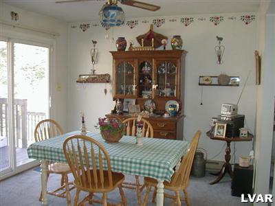 3396 Blue Ridge Road Saylorsburg, PA 18353 - Photo 3 of 11 a view of a dining room with furniture and a window