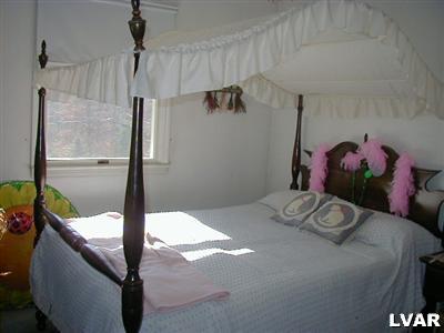 3396 Blue Ridge Road Saylorsburg, PA 18353 - Photo 4 of 11 a bedroom with a bed and a window