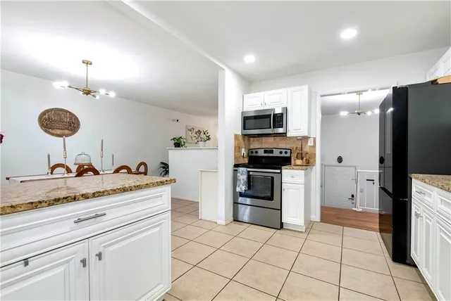 a view of a dining room with furniture and a table