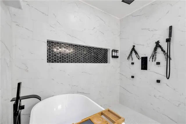 a view of empty room with wooden floor and cabinet