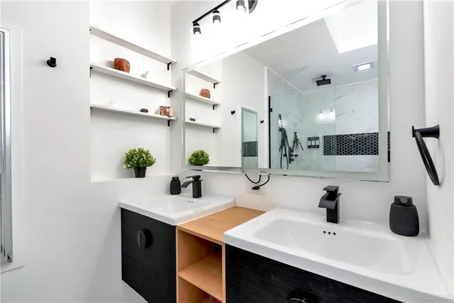 a kitchen with granite countertop a sink and cabinets