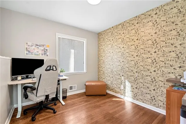 a view of a bedroom with washer and dryer