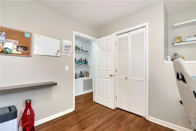 a kitchen with a cabinets and wooden floor