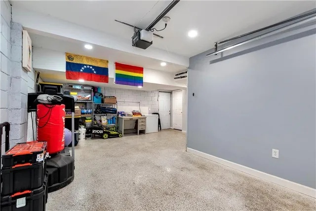 a view of a house with snow on the road