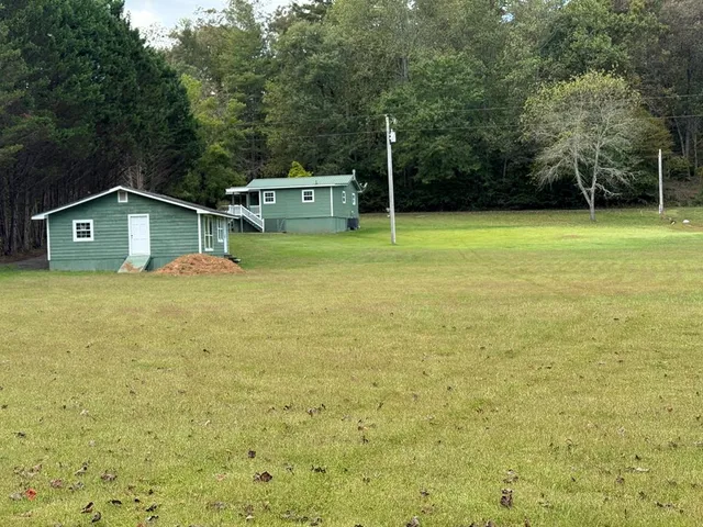a house with trees in the background