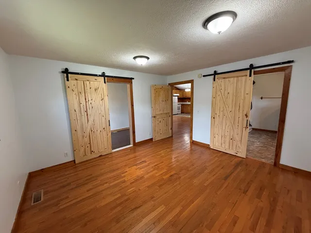 a view of entryway with wooden floor
