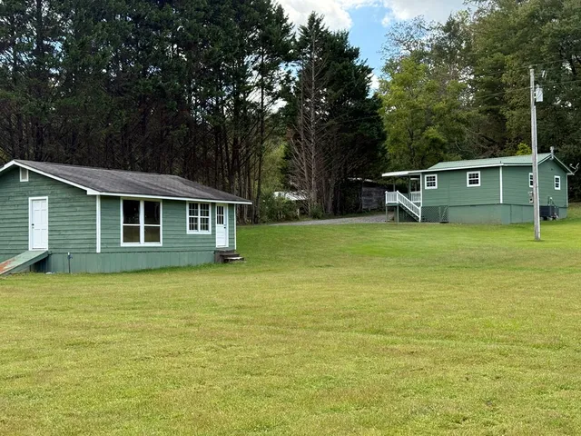 a front view of a house with swimming pool