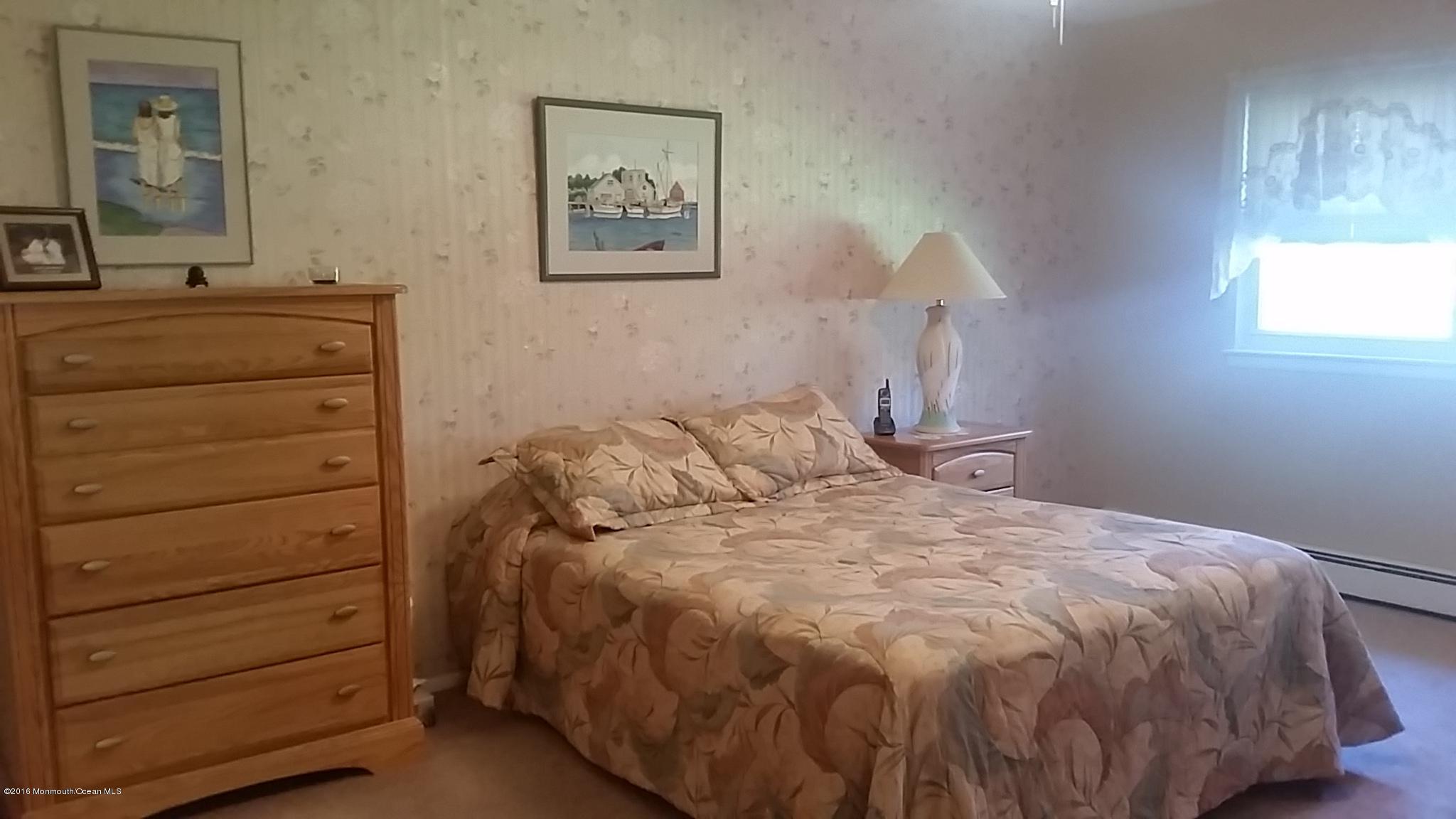 24 East Road, Unit A Jackson, NJ 08527 - Photo 17 of 24 a bedroom with a bed and a dresser