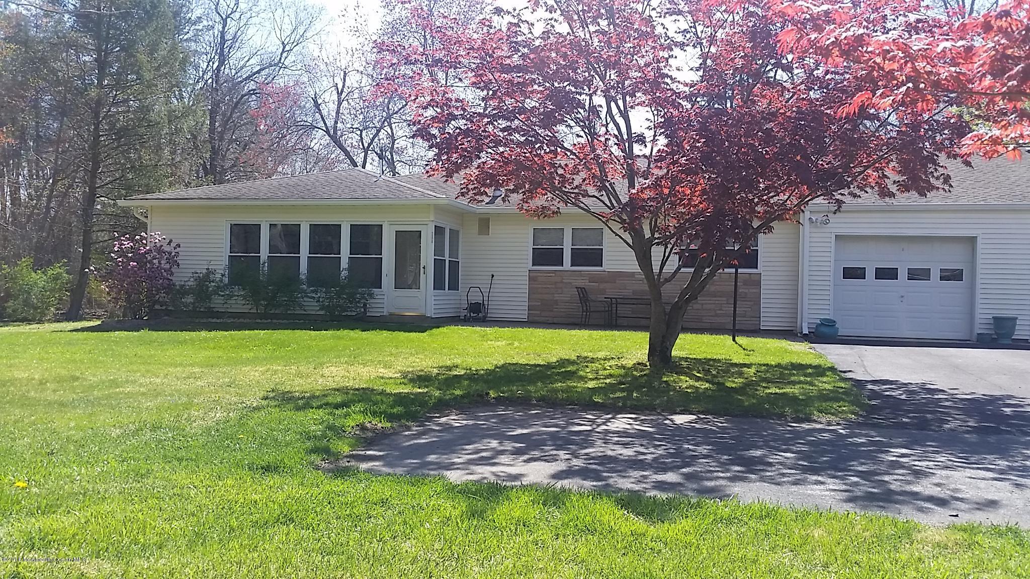 24 East Road, Unit A Jackson, NJ 08527 - Photo 2 of 24 a view of a yard in front of a house with large trees