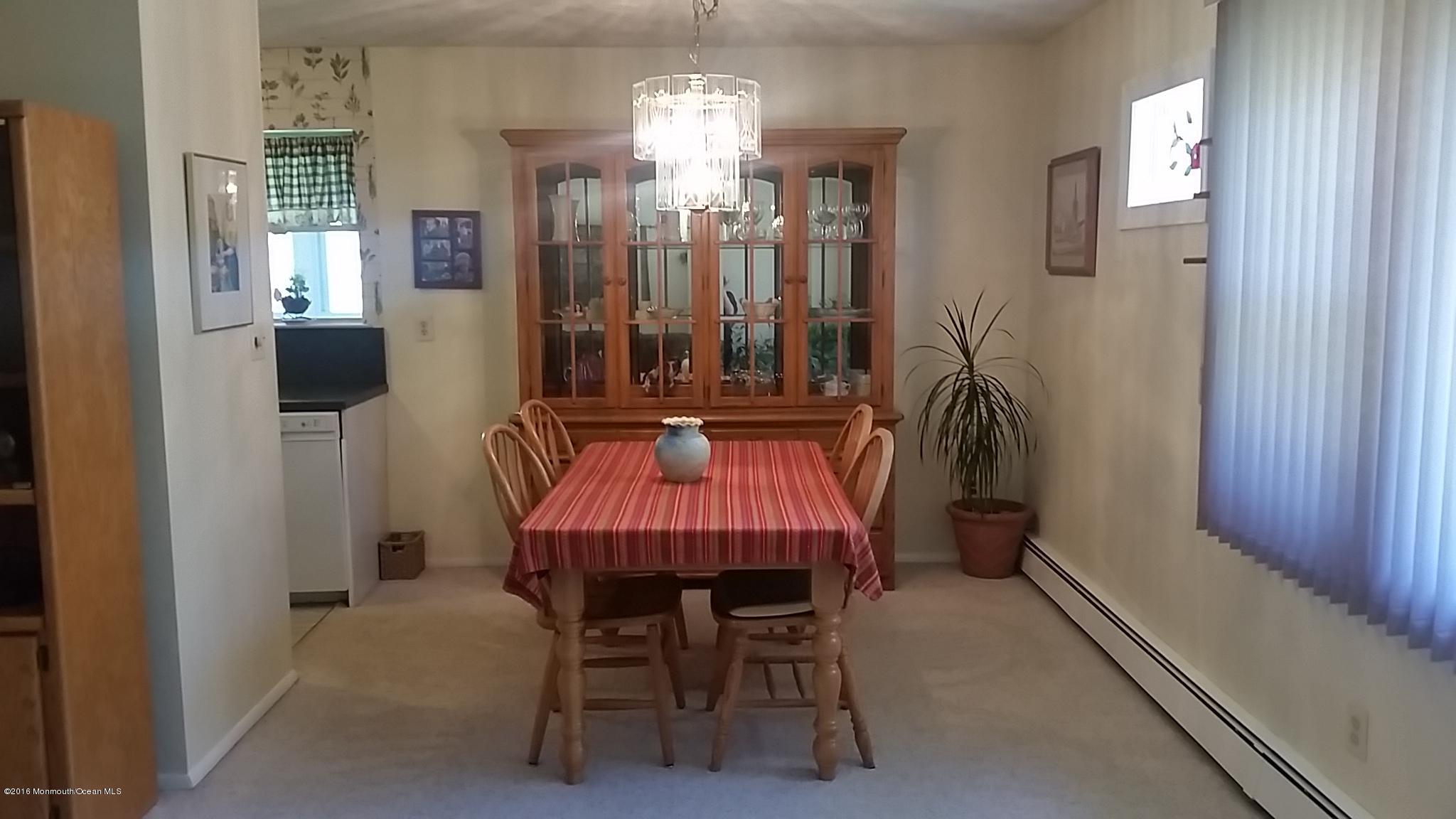 24 East Road, Unit A Jackson, NJ 08527 - Photo 10 of 24 a view of a dining room with furniture and chandelier