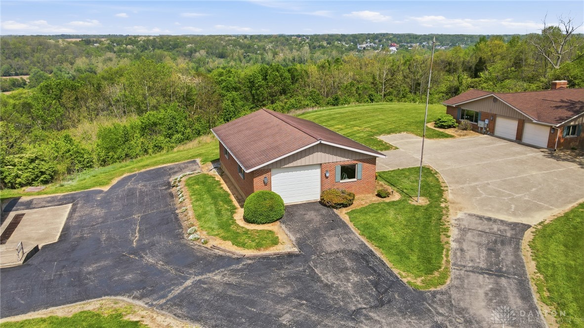 5669 O Neall Road Waynesville, OH 45068 - Photo 11 of 72 This property features multiple outbuildings and expansive grounds, offering ample space and versatility.