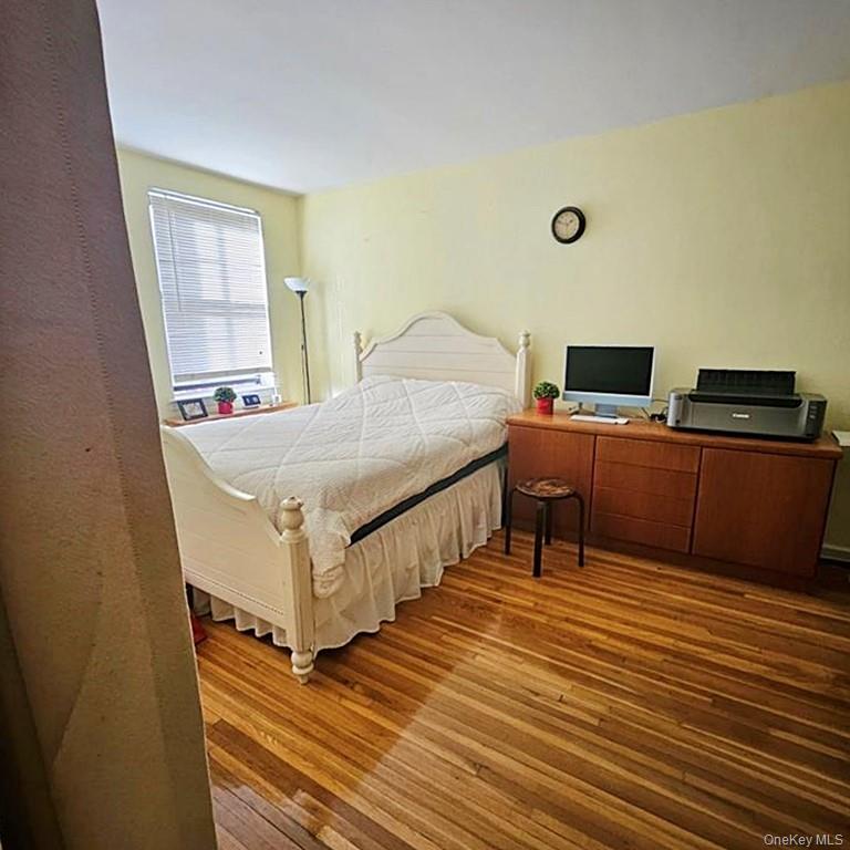 215-43 48th Avenue, Unit 3B Queens, NY 11364 - Photo 8 of 14 a room with furniture pool table and flat screen tv