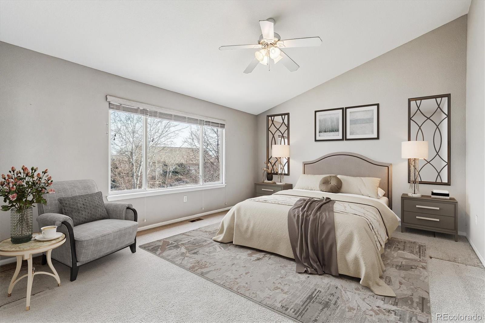 6485 Silverleaf Avenue Firestone, CO 80504 - Photo 13 of 29 a spacious bedroom with a bed and a couch