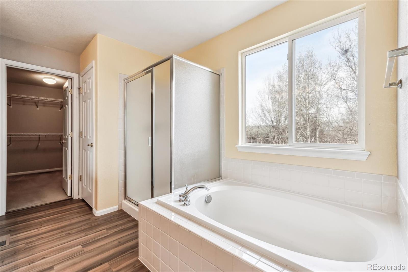 6485 Silverleaf Avenue Firestone, CO 80504 - Photo 15 of 29 a bathroom with a bathtub and a shower