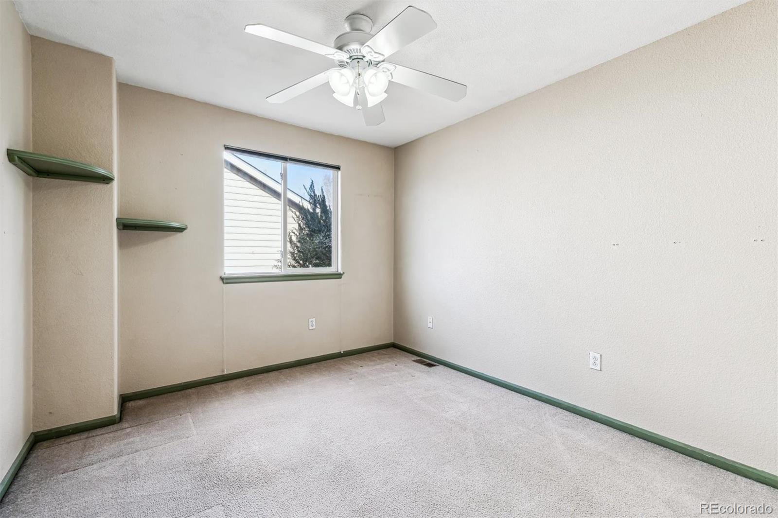 6485 Silverleaf Avenue Firestone, CO 80504 - Photo 18 of 29 an empty room with windows and fan