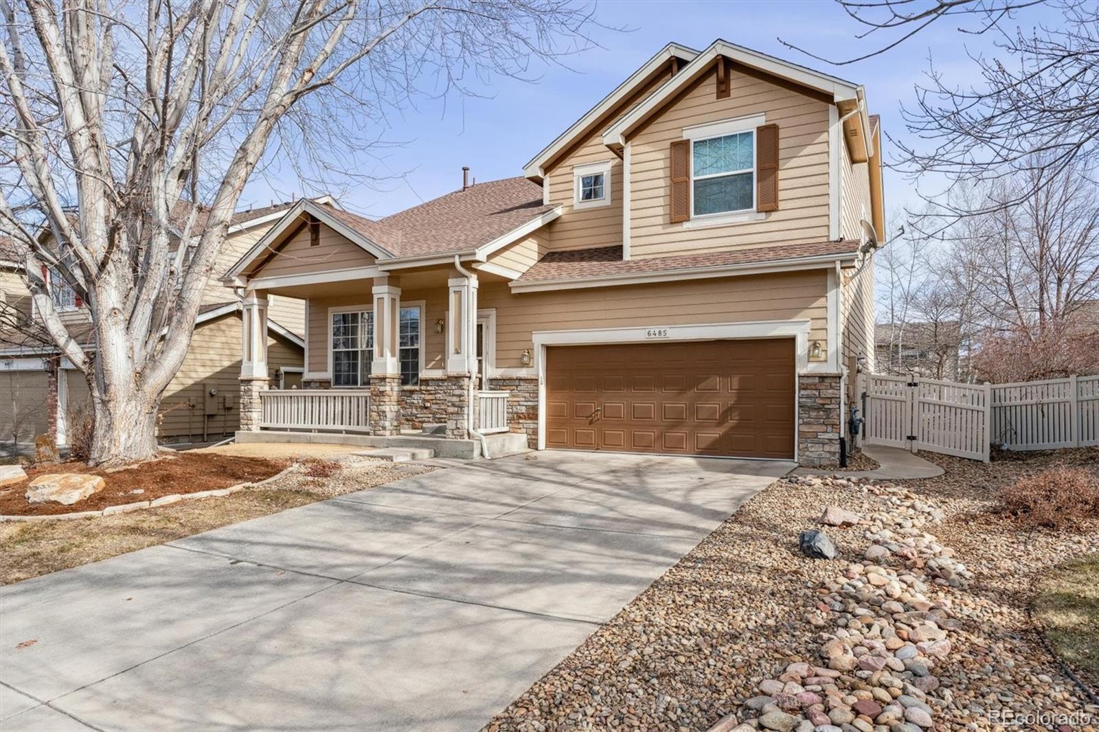 6485 Silverleaf Avenue Firestone, CO 80504 - Photo 2 of 29 a front view of a house with a yard and garage