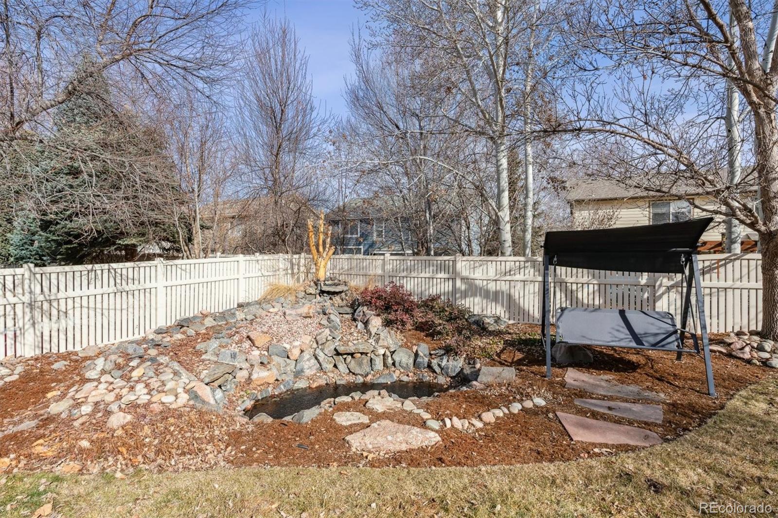 6485 Silverleaf Avenue Firestone, CO 80504 - Photo 23 of 29 a view of a yard with wooden fence