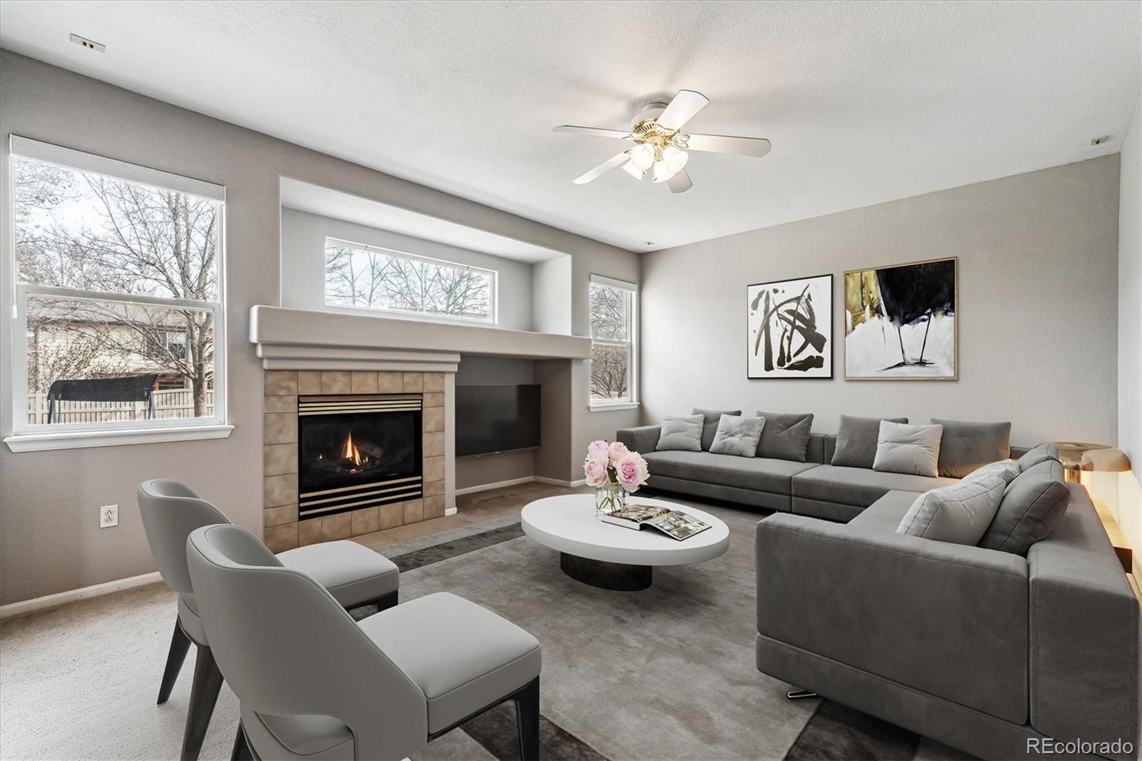 6485 Silverleaf Avenue Firestone, CO 80504 - Photo 4 of 29 a living room with furniture and a fireplace