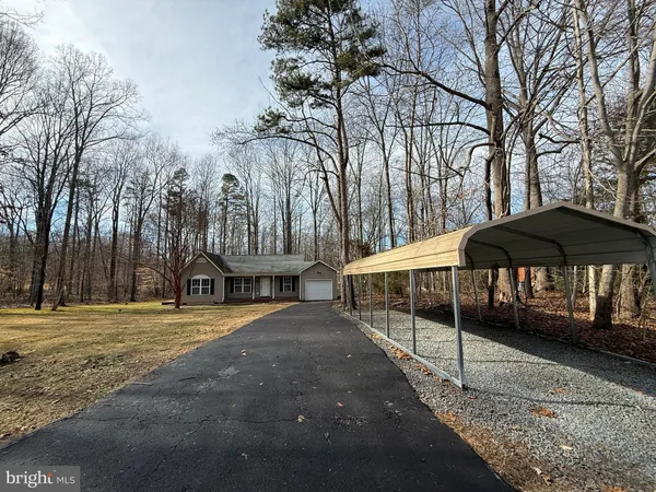 a view of a park with iron fence