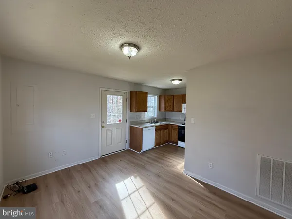 a view of kitchen with wooden floor