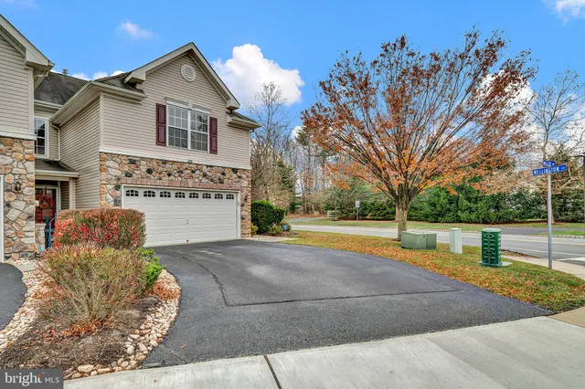 a view of a house with swimming pool and sitting area